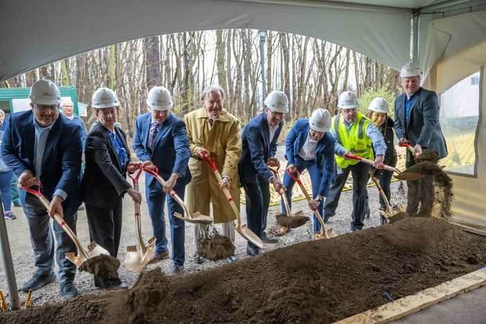 Guests shovel dirt at the groundbreaking ceremony for a new KYOCERA AVX facility at Penn State Behrend